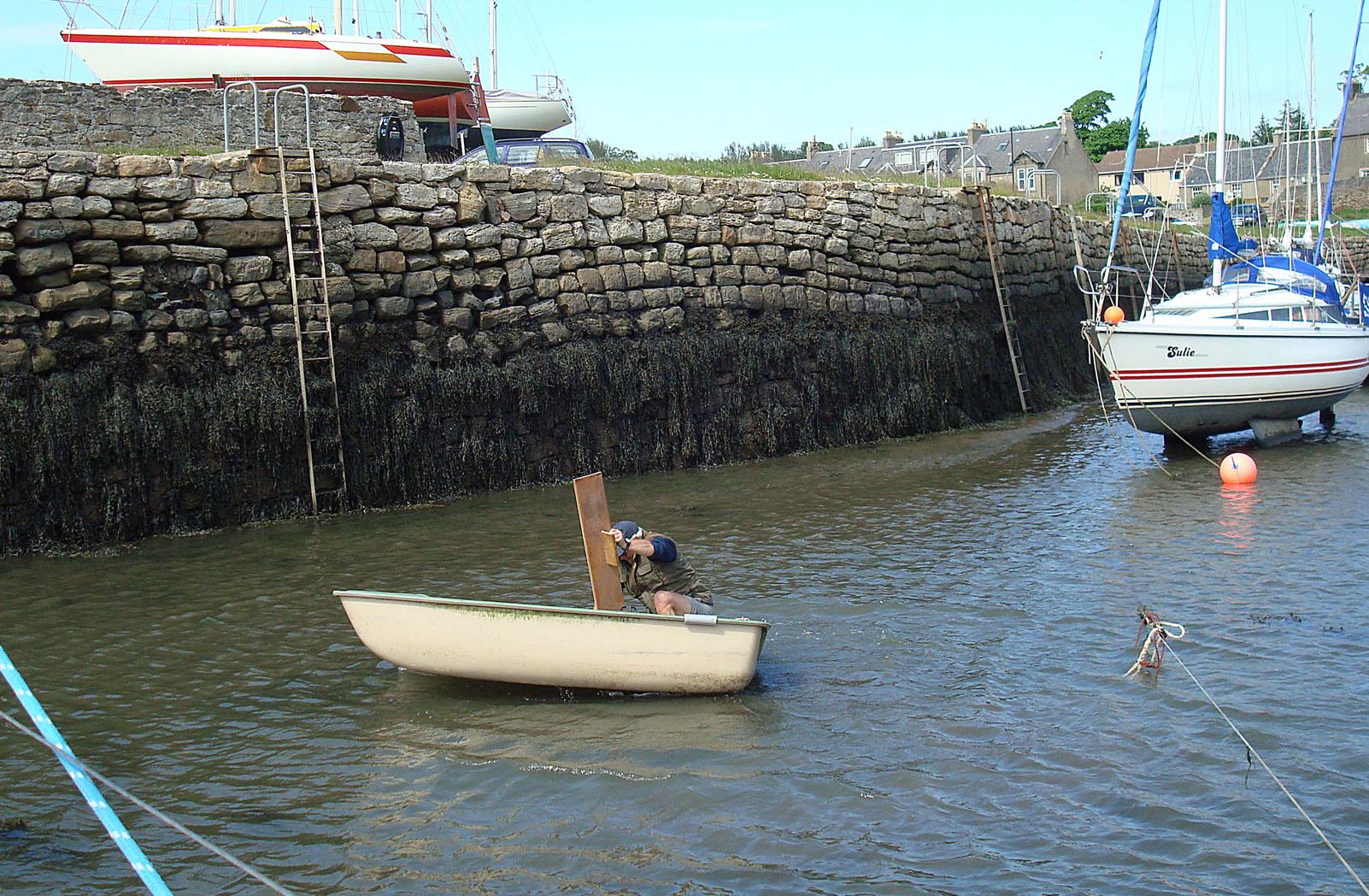 into the water, retrieving dinghy